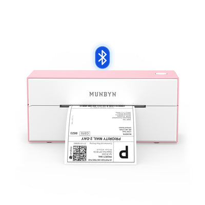 Pink Bluetooth thermal label printer printing a shipping label on white background