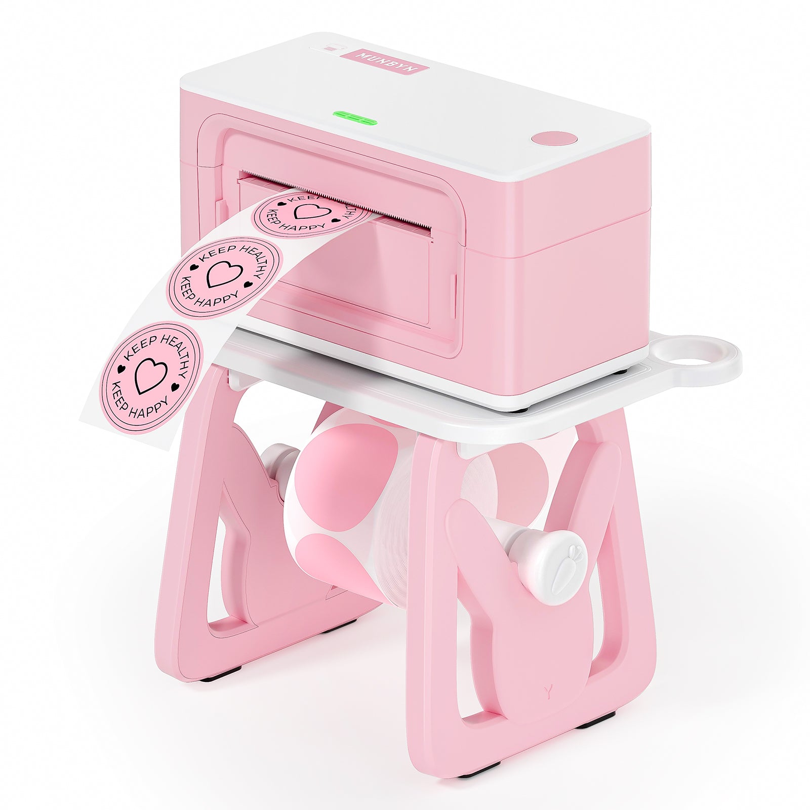 Pink thermal label printer printing round stickers reading 'KEEP HEALTH KEEP HAPPY' with a bunny-shaped holder.