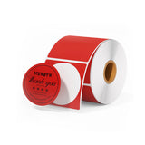 Roll of 2-inch round red thermal thank you stickers, ideal for shipping labels and packaging.