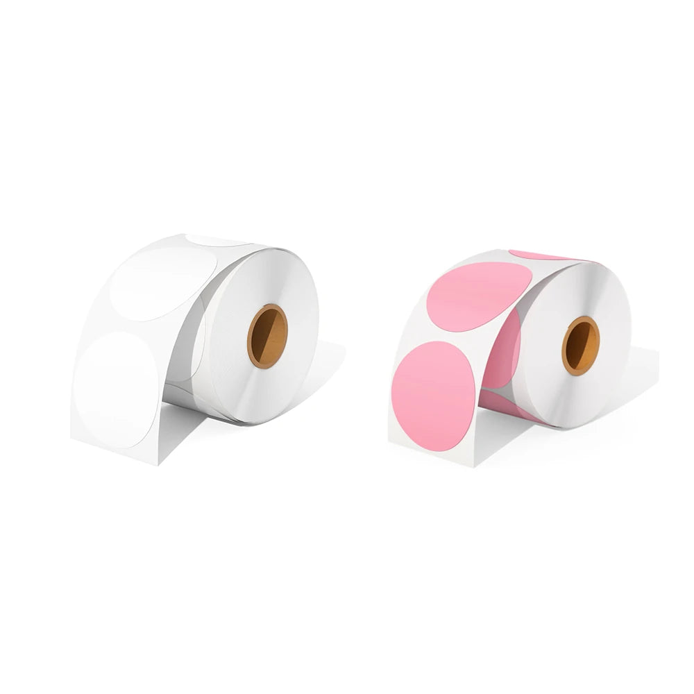 A roll of white circle thermal labels and a roll of pink circle thermal labels