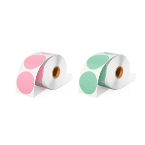 A roll of pink circle thermal labels and a roll of green circle thermal labels